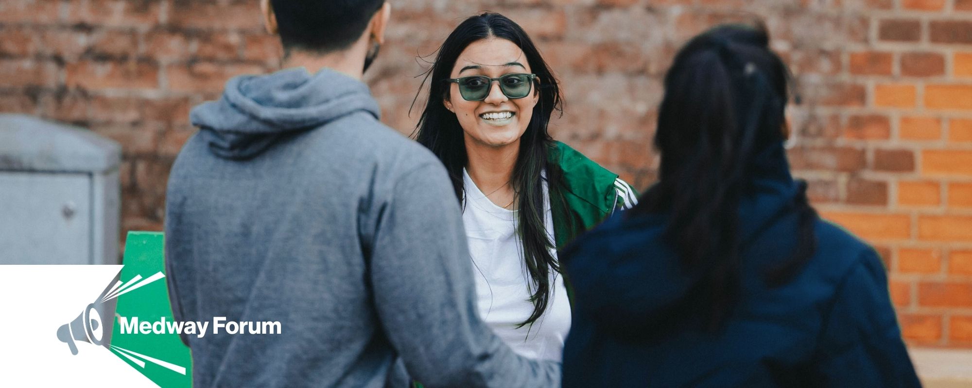 Medway Forum text with megaphone. Photo of students talking